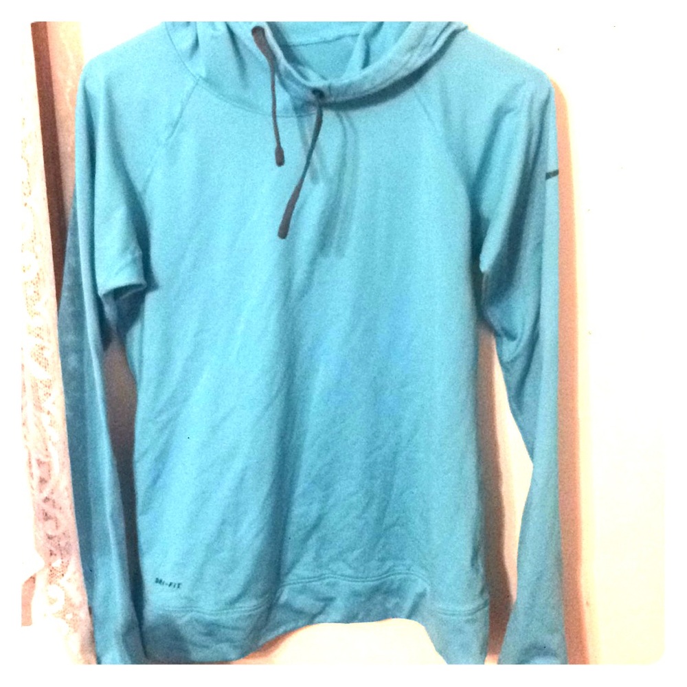 blue tight fitted Nike pro running hoodie